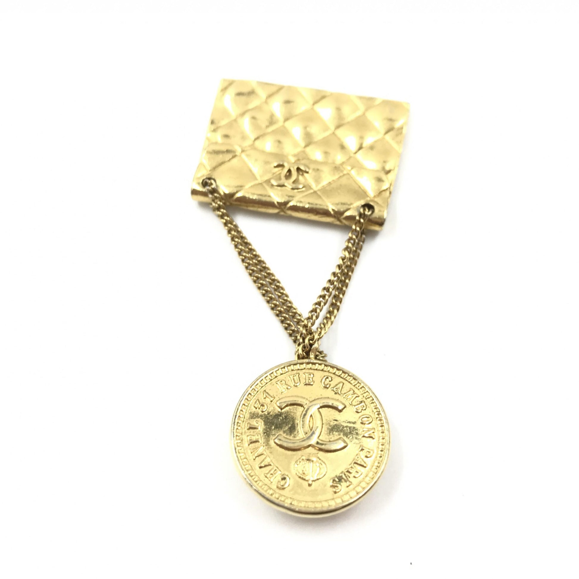 Broche motif sac plaqué or Chanel