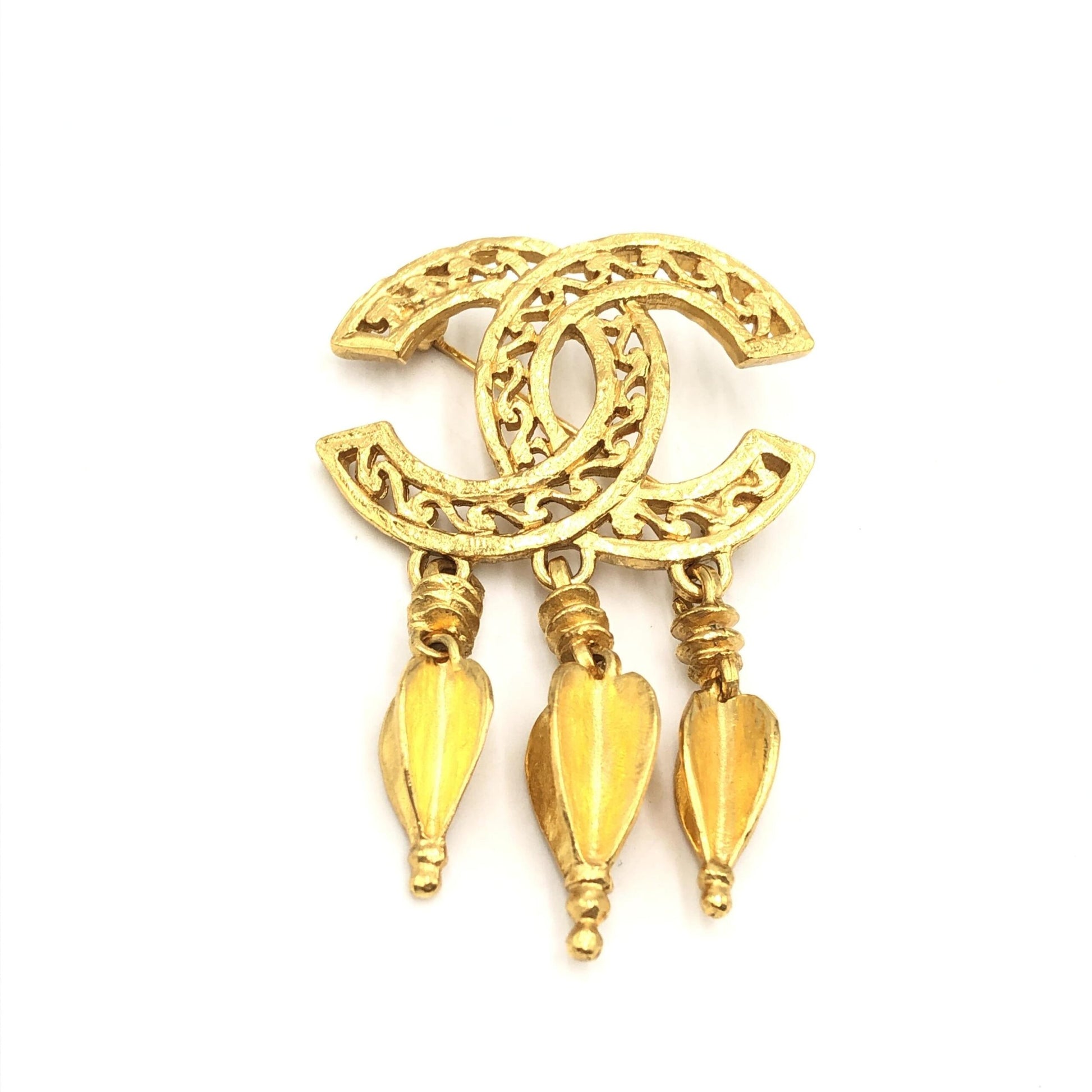Broche Chanel plaqué or avec logo CC