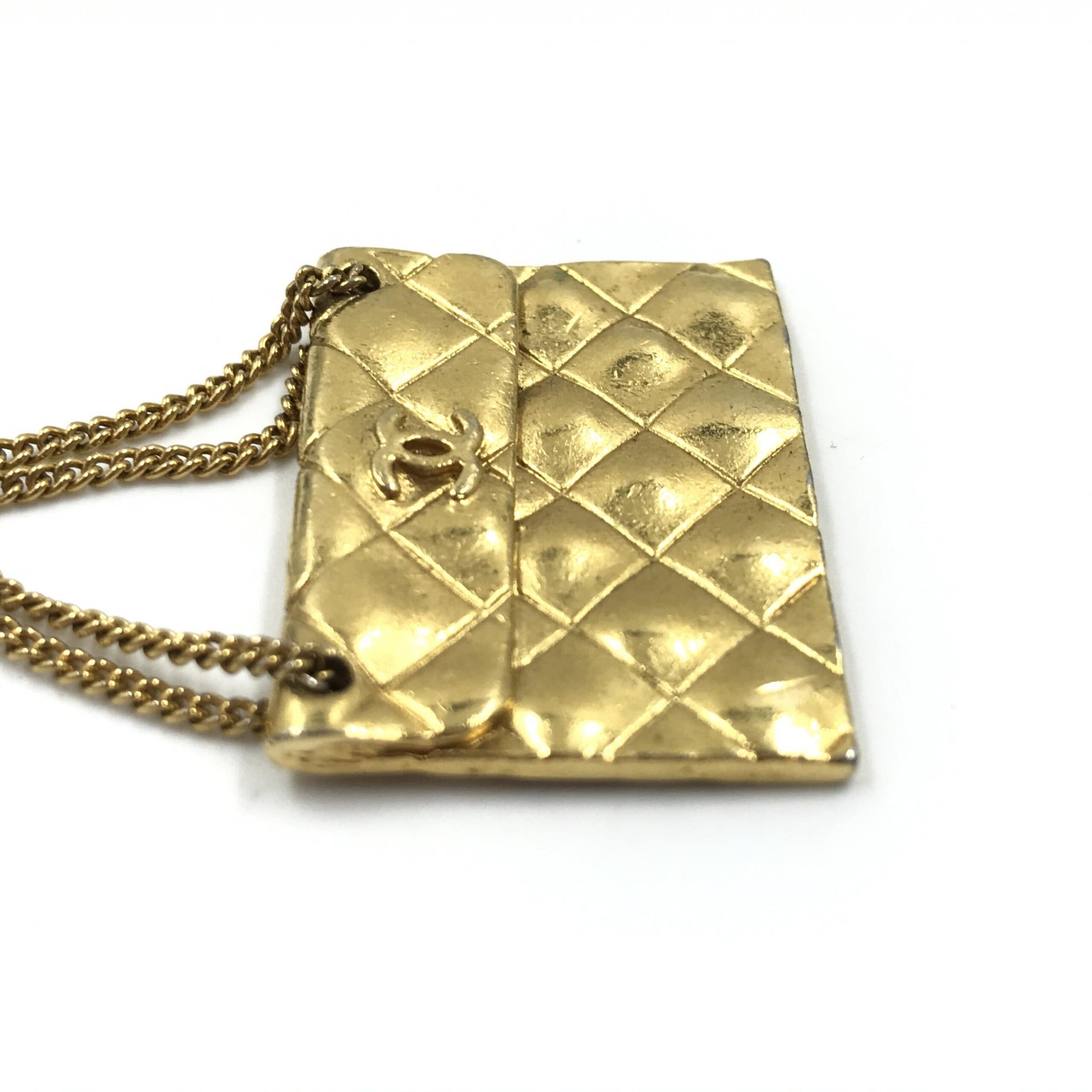 Broche motif sac plaqué or Chanel