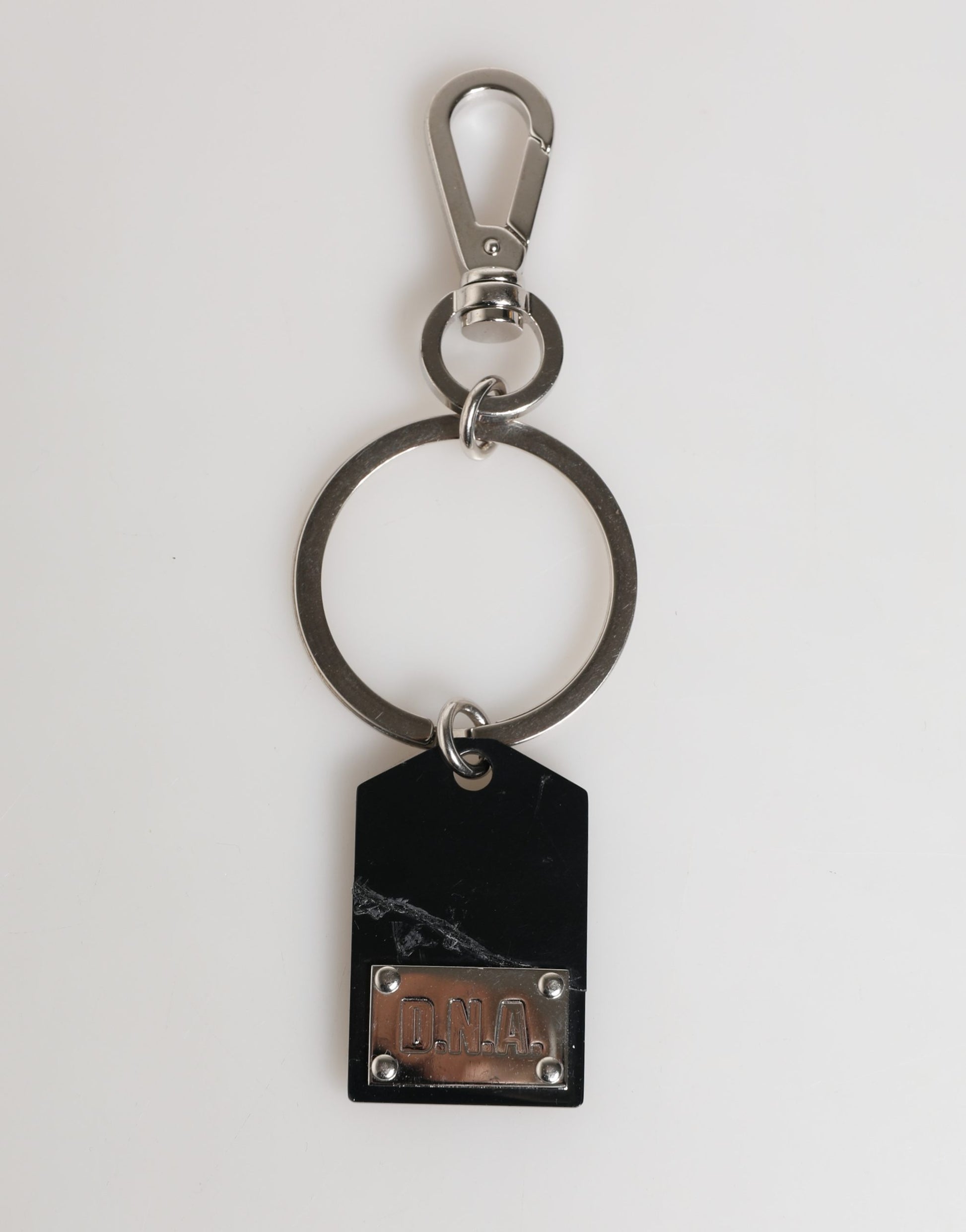 Dolce & Gabbana Porte-clés en métal argenté et laiton avec logo noir