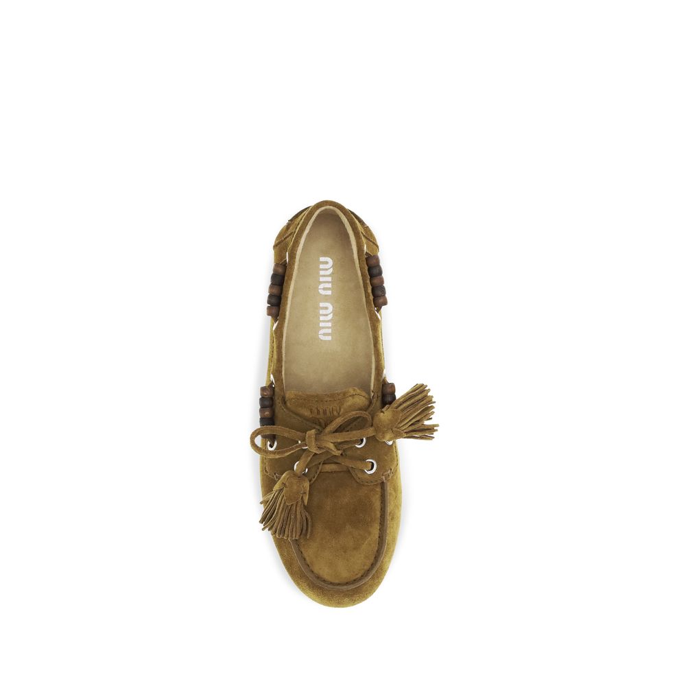 Mocassins à enfiler Miu Miu en cuir de veau beige (Bos Taurus)