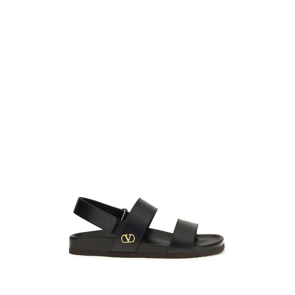 Valentino Garavani Sandales plates en cuir de veau noir Bos Taurus