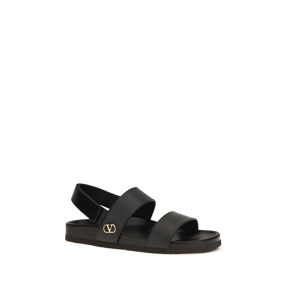 Valentino Garavani Sandales plates en cuir de veau noir Bos Taurus