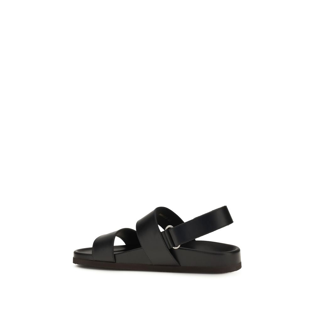 Valentino Garavani Sandales plates en cuir de veau noir Bos Taurus