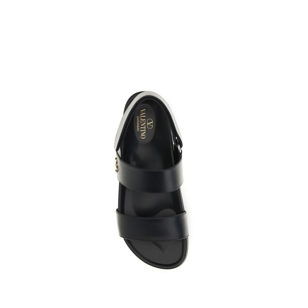 Valentino Garavani Sandales plates en cuir de veau noir Bos Taurus