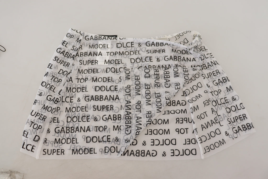 Mini-jupe évasée transparente à logo blanc Dolce & Gabbana