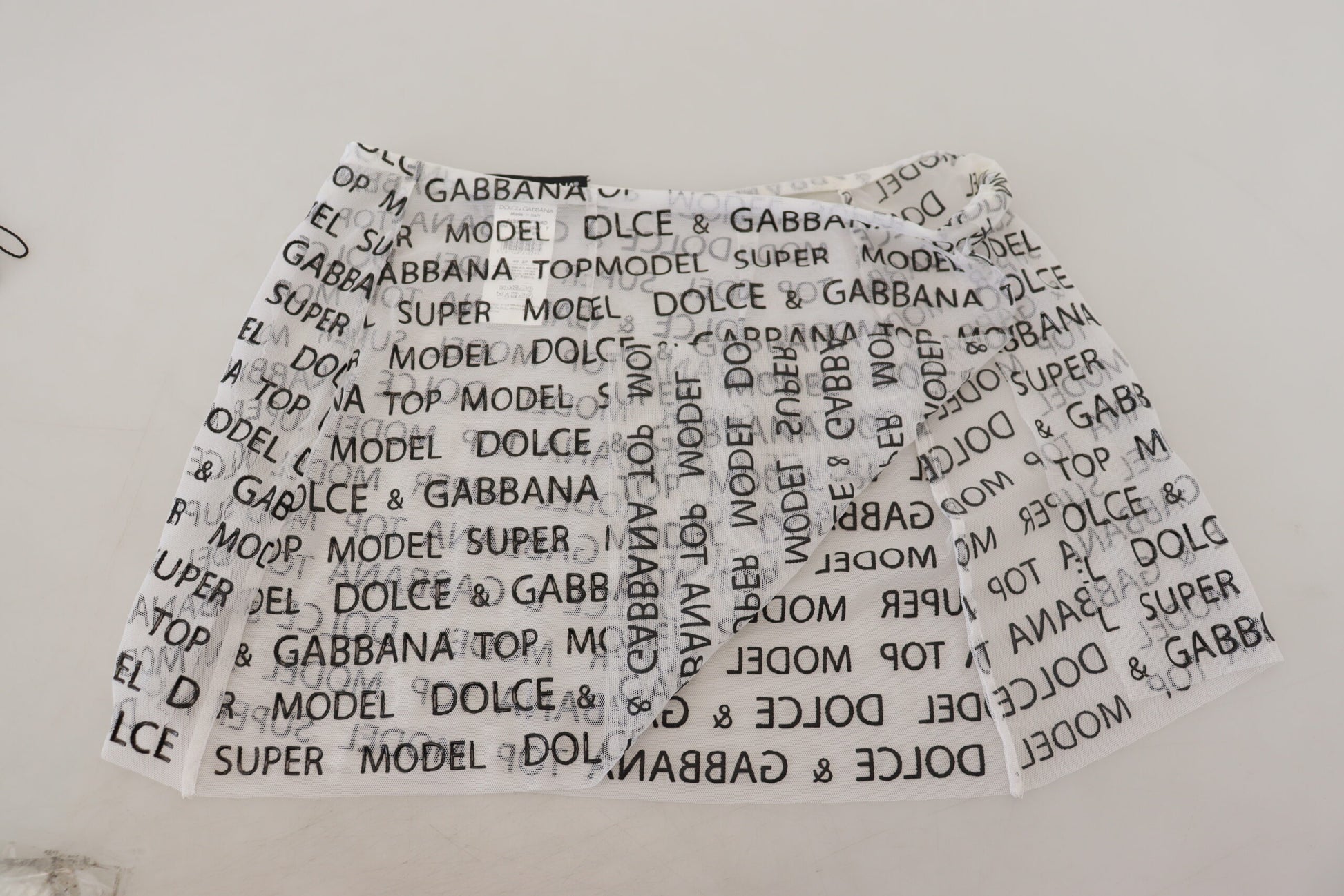 Mini-jupe évasée transparente à logo blanc Dolce & Gabbana