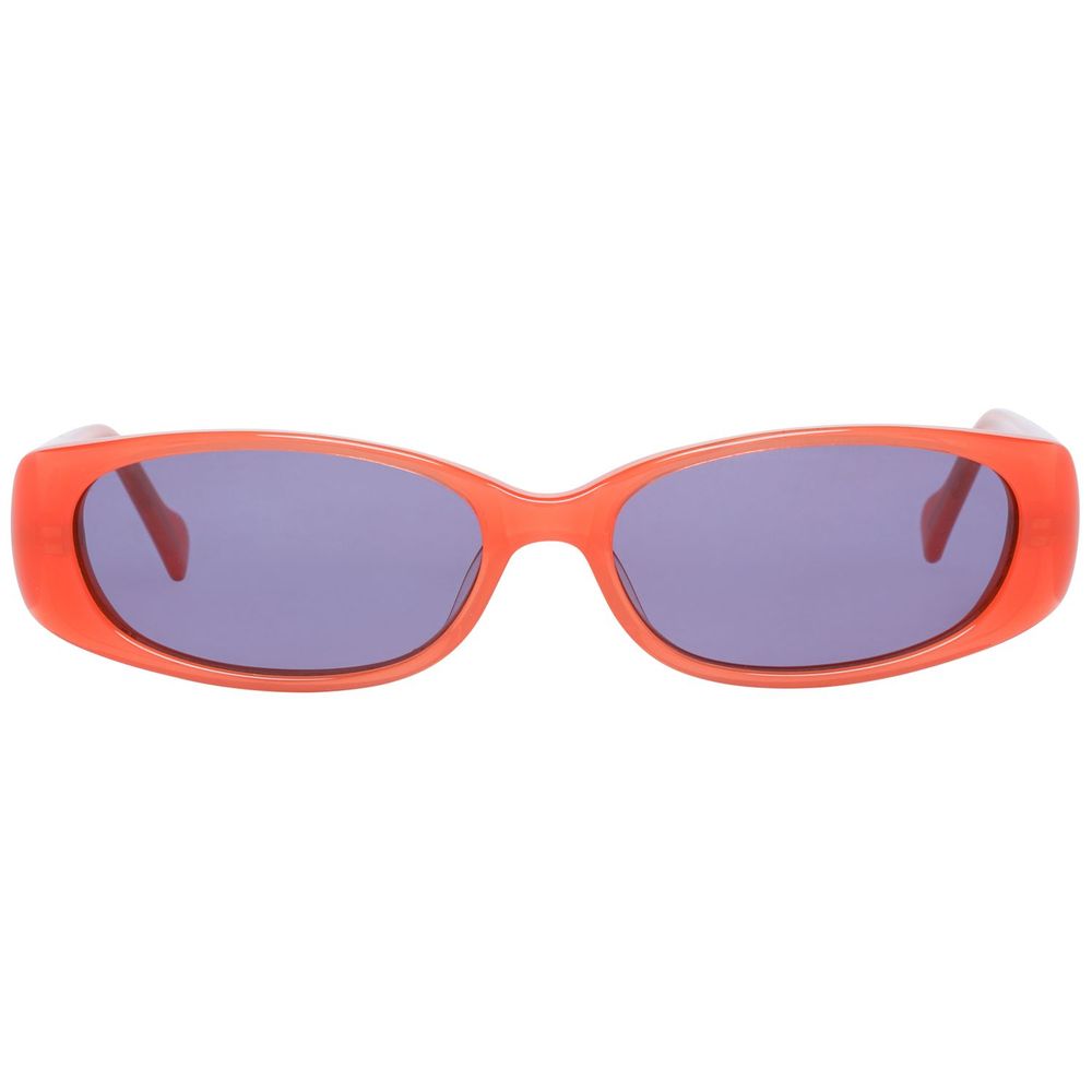 Des lunettes de soleil en plastique orange en pagaille