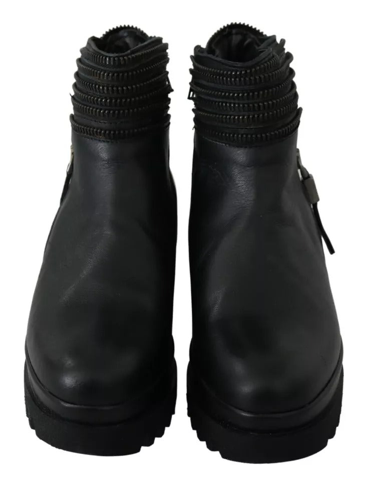 Ovyé Schwarze Lederstiefeletten mit Reißverschluss