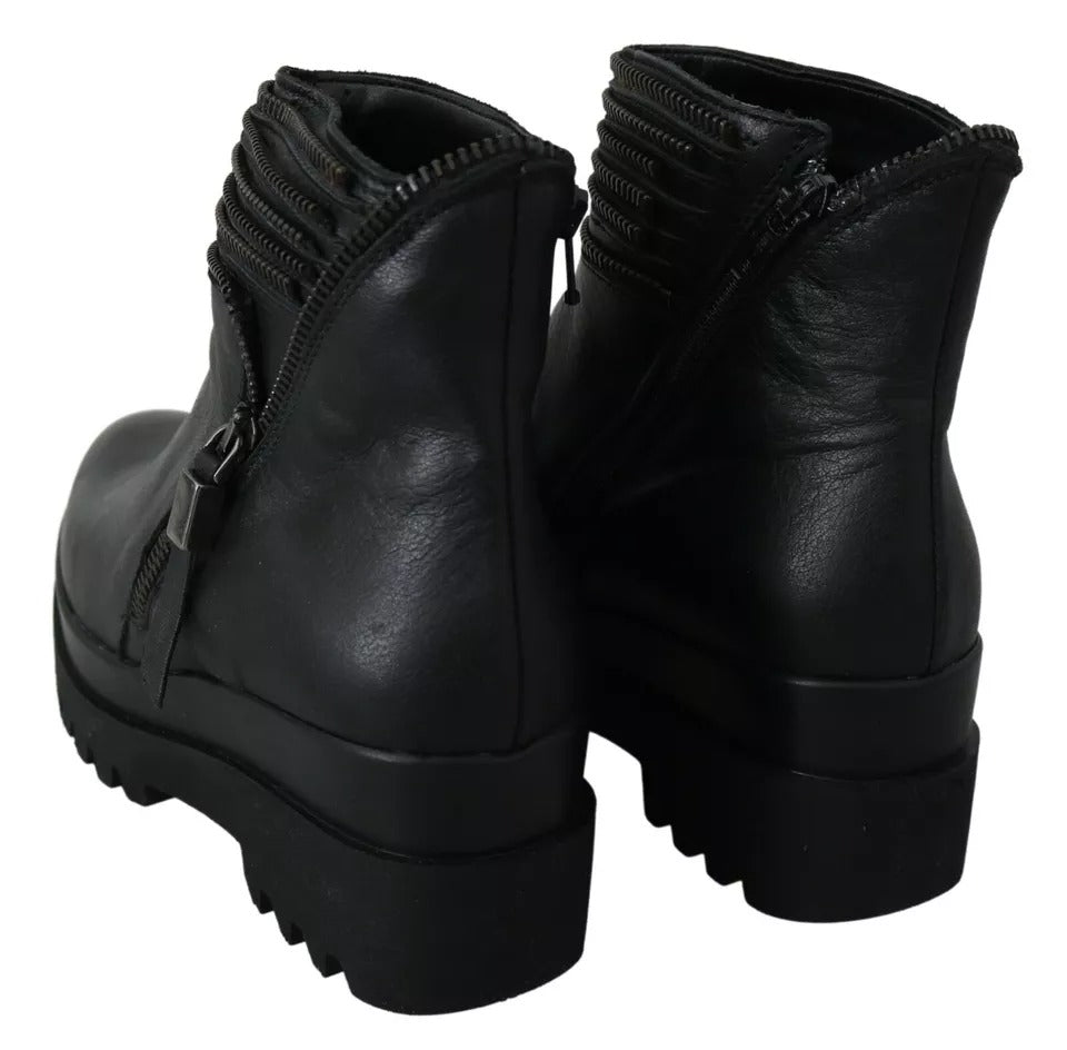Ovyé Schwarze Lederstiefeletten mit Reißverschluss