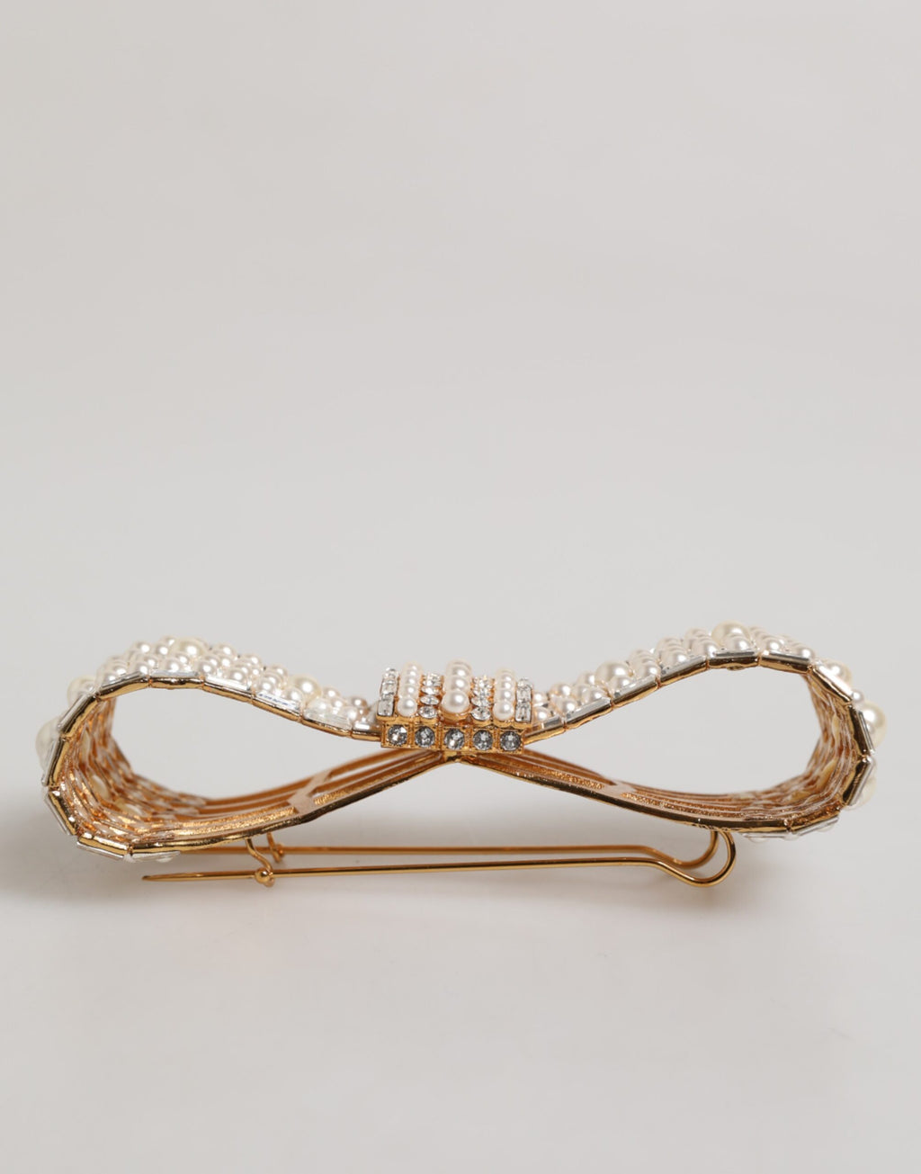 Broche Dolce & Gabbana en laiton doré, ornée d'un nœud en cristal et de fausses perles