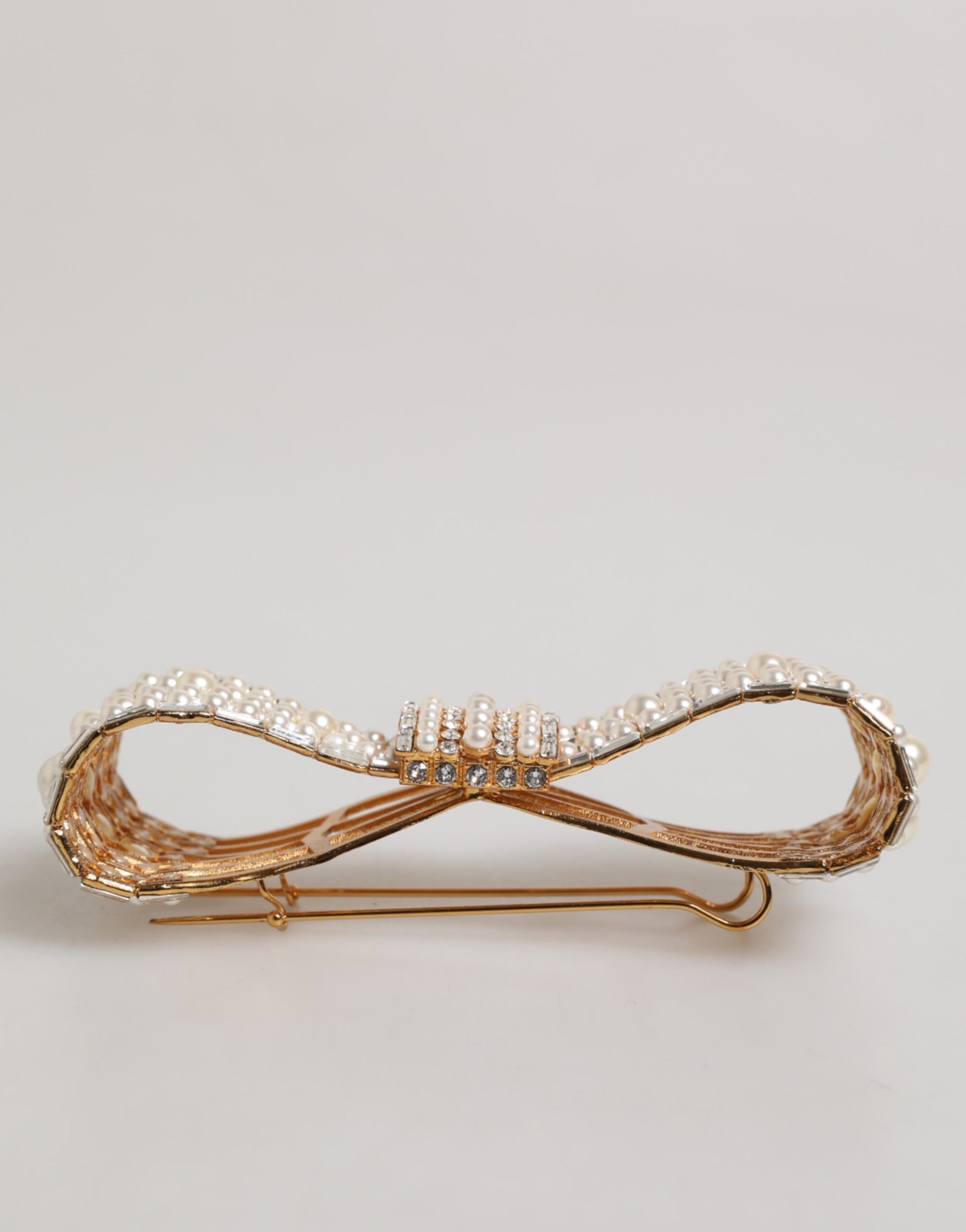 Broche Dolce & Gabbana en laiton doré, ornée d'un nœud en cristal et de fausses perles