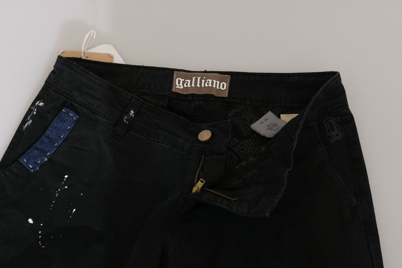 Jean slim noir taille basse à peinture blanche John Galliano