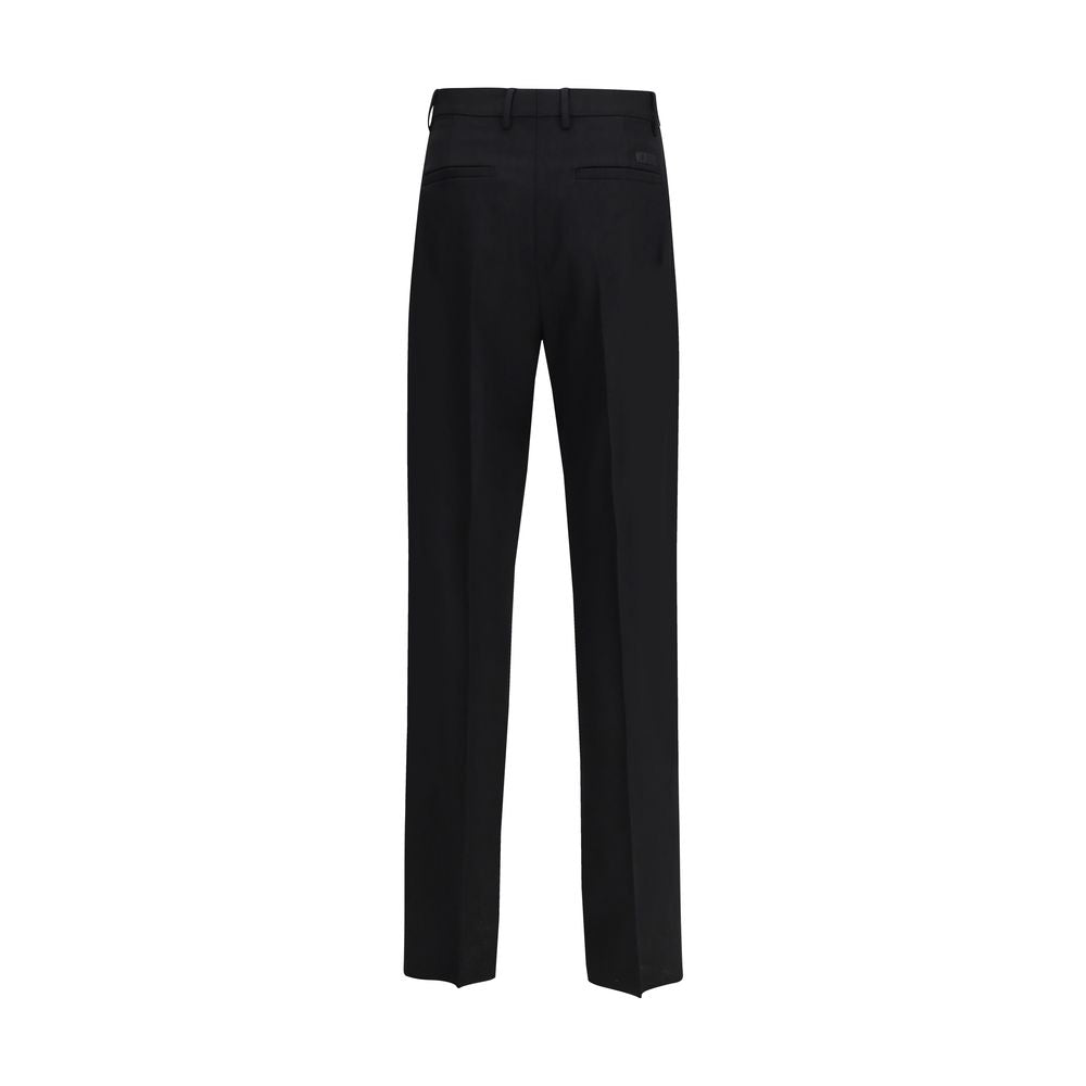 Pantalon habillé Versace en laine noire Oves Aries