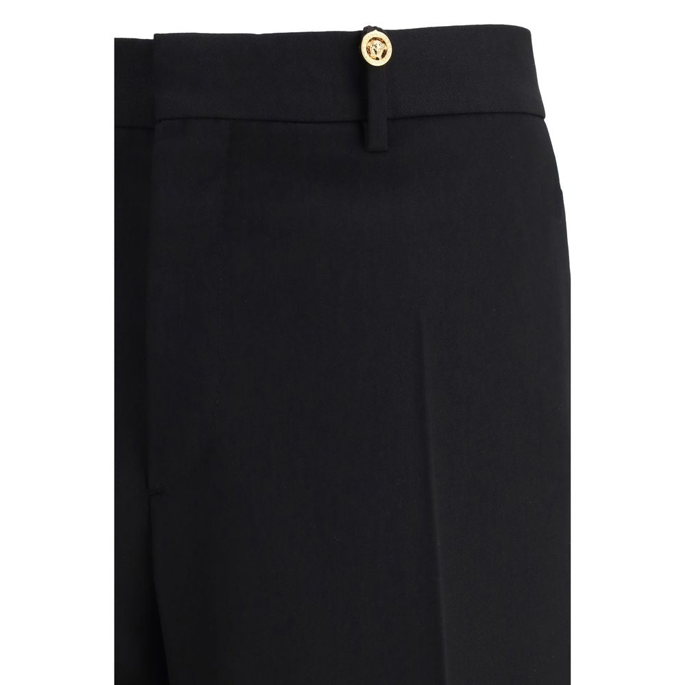 Pantalon habillé Versace en laine noire Oves Aries